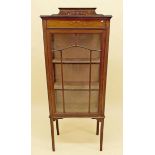 An Edwardian inlaid mahogany display cabinet