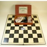 An early 20th century painted lead 'The Rose' chess set and board