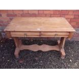 A Victorian pine side table with two frieze drawers over shaped stretcher, 109cm wide, 54 deep and