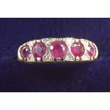 A 9 carat gold ruby and diamond ring, size N