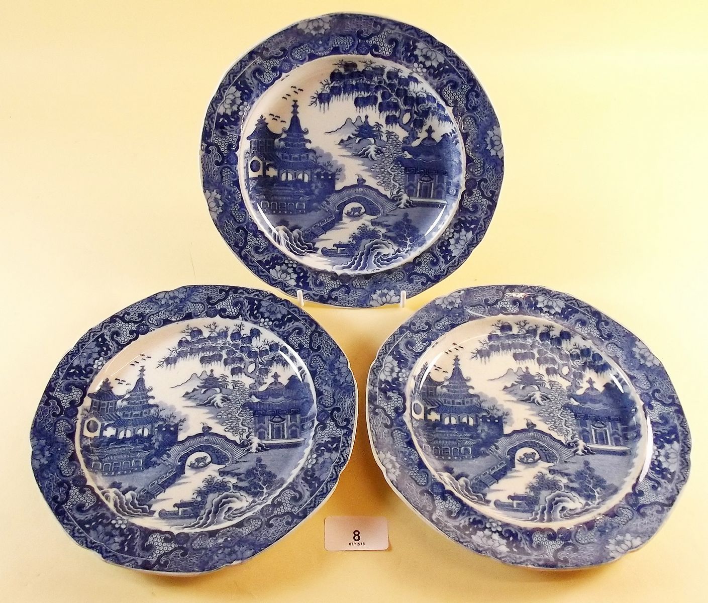 Three blue and white transfer print pearlware plates 'Bridge and Pagoda' pattern c.1800