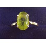 A 14 carat gold ring set peridot, size P