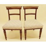 A pair of Regency style mahogany bar back dining chairs with upholstered seats