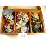 A box of costume brooches