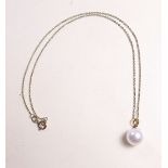 A large white pearl on 18 carat gold mount and chain