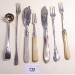 A small collection of silver cutlery items including three pickle forks and one other, two silver