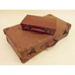 A Smiths Trunk Stores leather suitcase and another small case