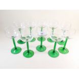 A set of ten green stemmed hock glasses