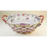 A Coalport Coalbrookdale pierced basket with handpainted floral decoration decorated applied flowers