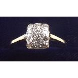 A white gold or platinum ring pave set square panel of twelve diamonds, size P