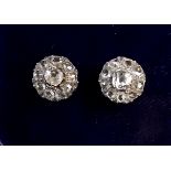 A pair of rhodium plated 18k gold diamond cluster earrings set old cut stones