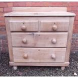 A pine chest of drawers with two long and two short drawers on bun feet, 87 wide, 44 deep and 85cm