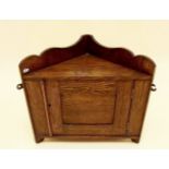 A small oak corner wall cabinet - 35cm high