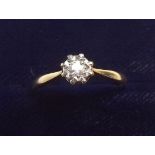 An 18 carat gold and diamond solitaire ring - size O