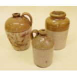 Two single handled stone jars and another