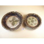 Two possible late 19th century papier mache bowls decorated flowers on black background with gold