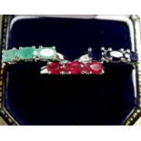 A trio of silver rings set sapphire, ruby and emerald, size P