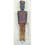 A 19th century naive hand carved wooden doll or puppet, in the form of a soldier 37cm tall