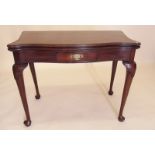 A George III style mahogany serpentine top fold top tea table on cabriole supports - circa 1900