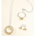 A silver pendant, ring and earrings set citrines