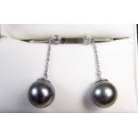 A pair of grey pearl and 18 carat white gold pendant earrings set diamonds on screw fittings