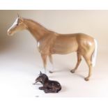 A large Beswick stallion and a Beswick foal a/f