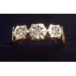 A 9 carat gold ring illusion set three diamonds, size N