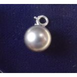 A large grey pearl pendant or charm