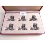 Six white metal teddy bear place setting stands