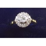 An early 20th century diamond cluster ring - 18 carat but mark worn, size N