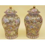 A pair of large late 20th century Chinese jars with lids - hairline to rim of one