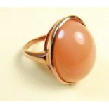 A peach moonstone set rose gold on silver ring