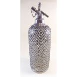 An early 20th century silver plate over glass soda siphon