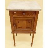 A marble topped oak pot cupboard with floral carved door