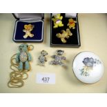 A teddy bear bling pendant and six brooches