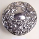 A silver circular trinket box embossed birds and scrollwork to lid - Birmingham 1971