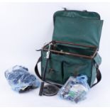 Fishing bag containing quantity of reels, gafs, weights, hooks and other fishing equipment