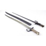 Chassepot bayonet of typical form dated 1871, brass grips with steel scabbard; Gras bayonet, 20½ ins