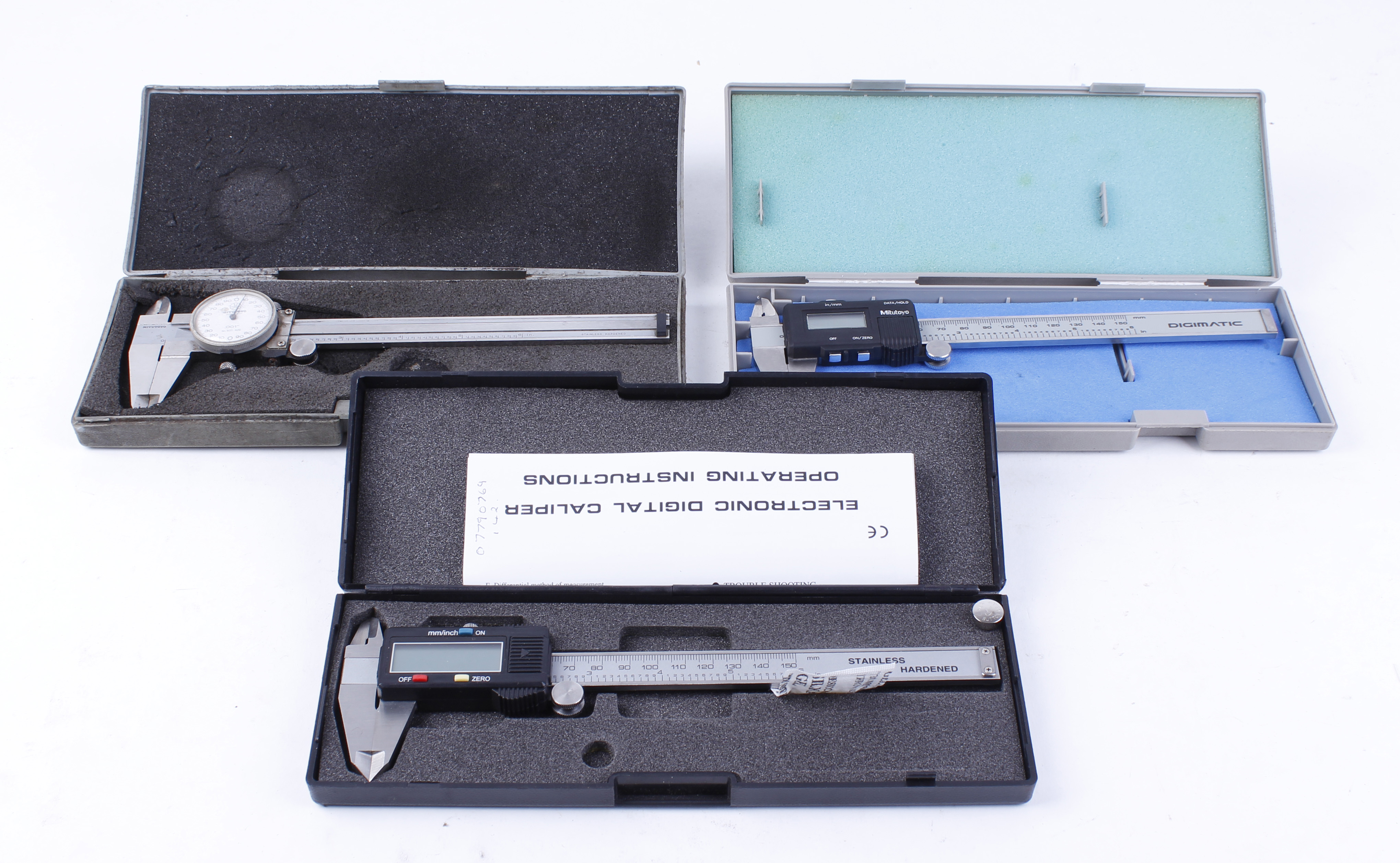 Two cased digital micrometers; One manual micrometer, cased