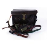 Leather bag containing ninteen various leather and webbing rifle slings