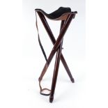 Leather seated wooden tri leg shooting stool