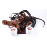 Five leather cartridge belts; leather belt; document wallet; two tubs saddle soap