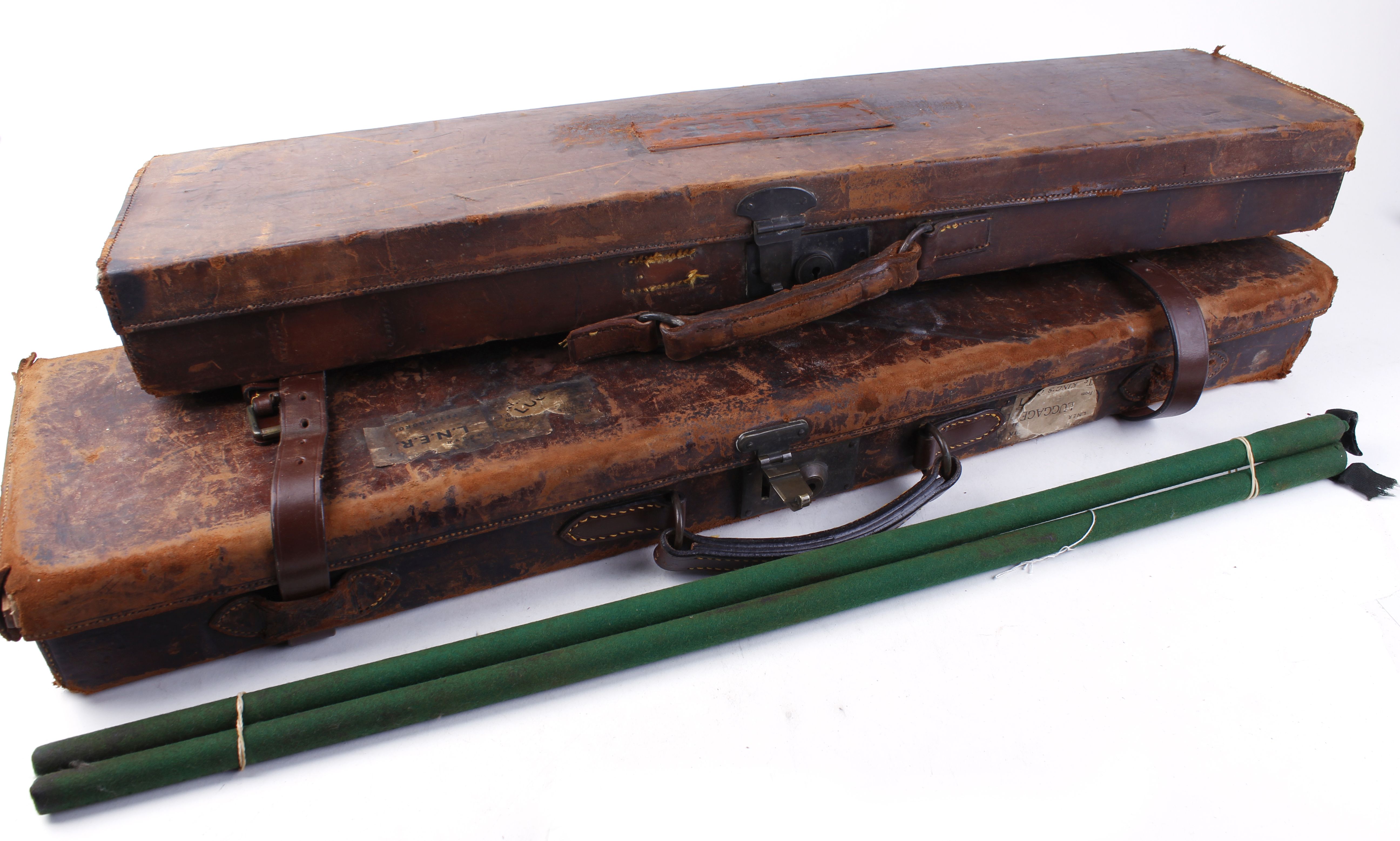 Leather gun case stamped R.H.F, green baize lined interior fitted for up to 28 ins barrels,