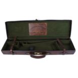 Leather gun case, green baize lined fitted interior for 30 ins barrels, Harrington & Hussey trade