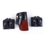 Two leather 'Hi-Power' double magazine pouches; Leather M750 pistol holster (3)