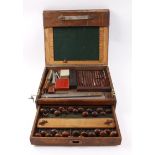 Oak cased set of engravers tooling, the lift up lid above a draw all containing over thirty