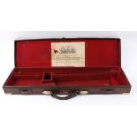 Leather gun case with fitted interior for 30 ins barrels, brass corders, P&O and other shipping
