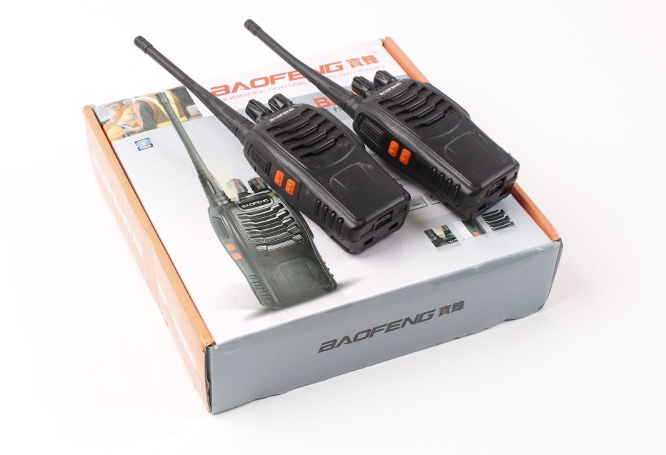 Baofeng portable two-way radio set, boxed with two chargers and instructions