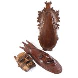 Two carved African masks and trophy shield
