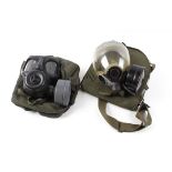 Two British issue gas masks in carry cases